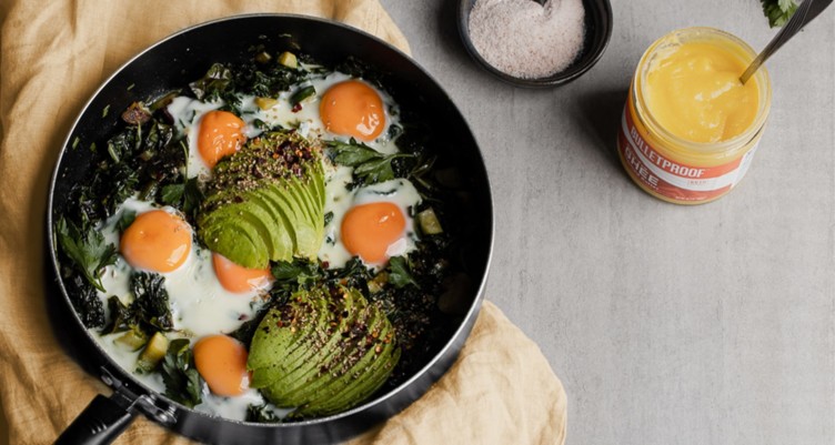 eggs and avocado on kale