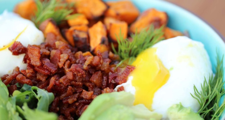 bacon eggs and sweet potatoes on a salad