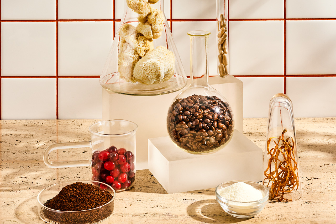 Different mushroom types, coffee berry and coffee beans in test tubes