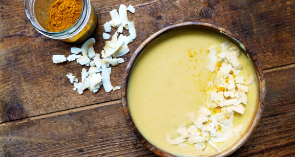 Yellow turmeric smoothie bowl